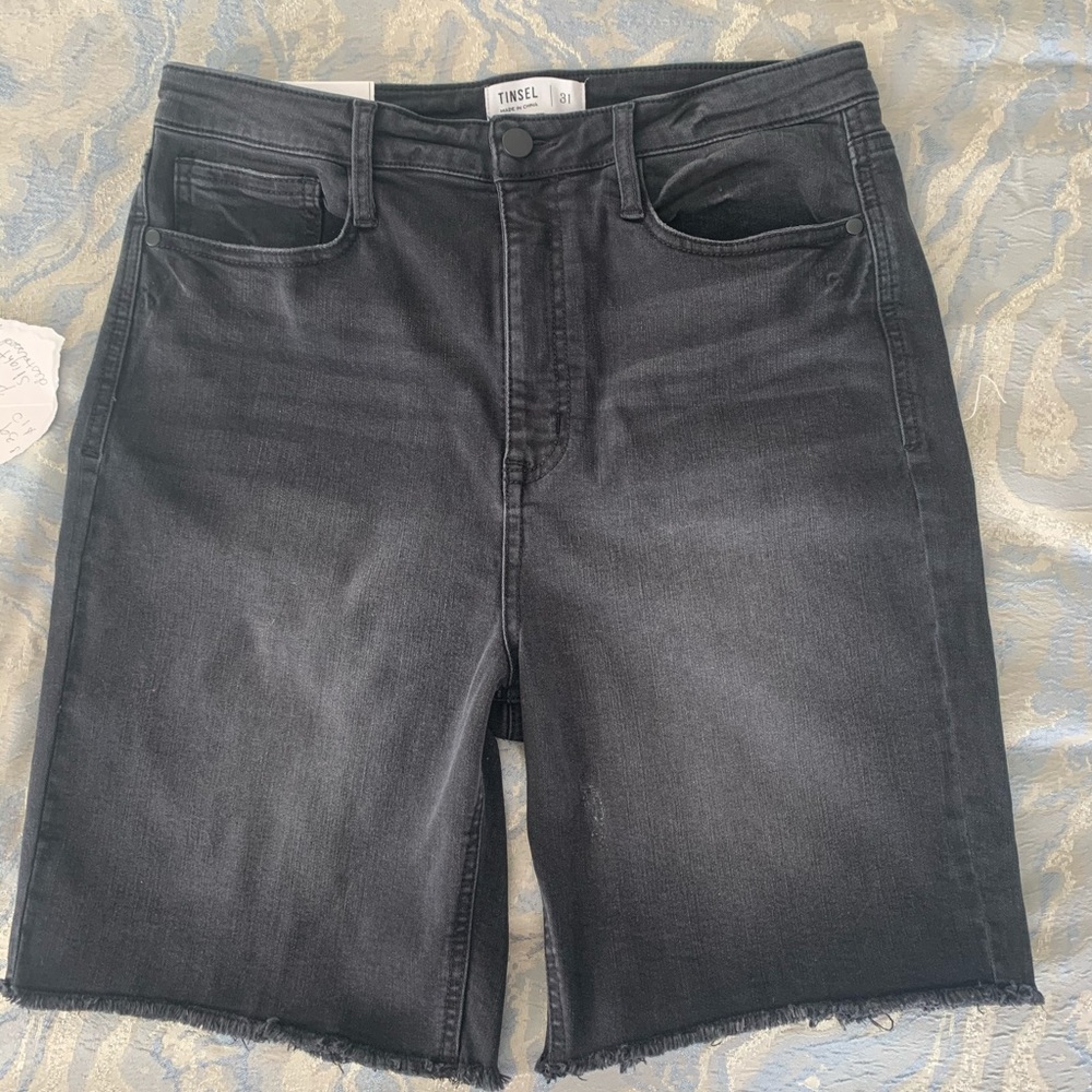 Tinsel Hi-rise black little destressed short.